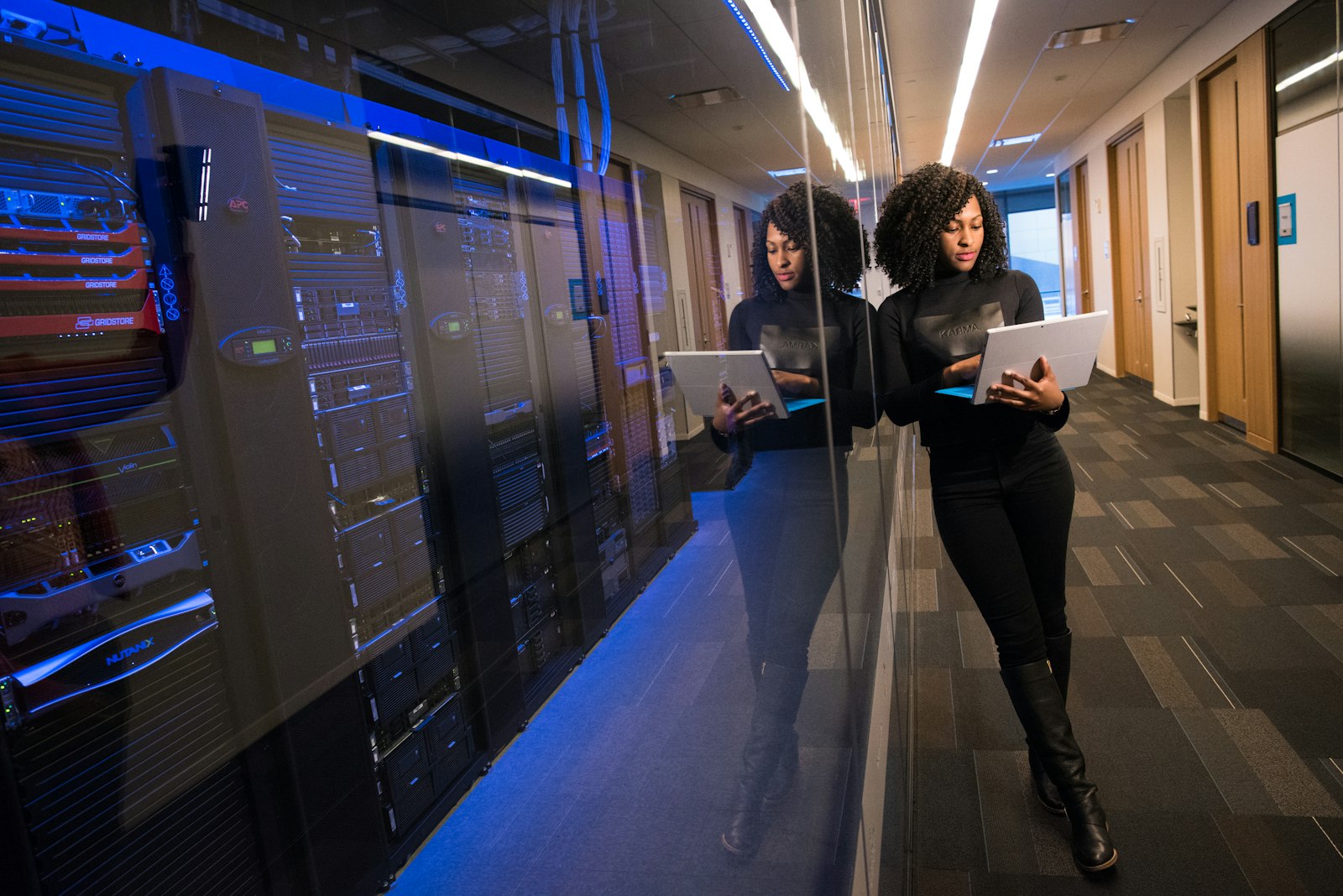 Security specialist testing a deployed LLM application from a data-centre corridor