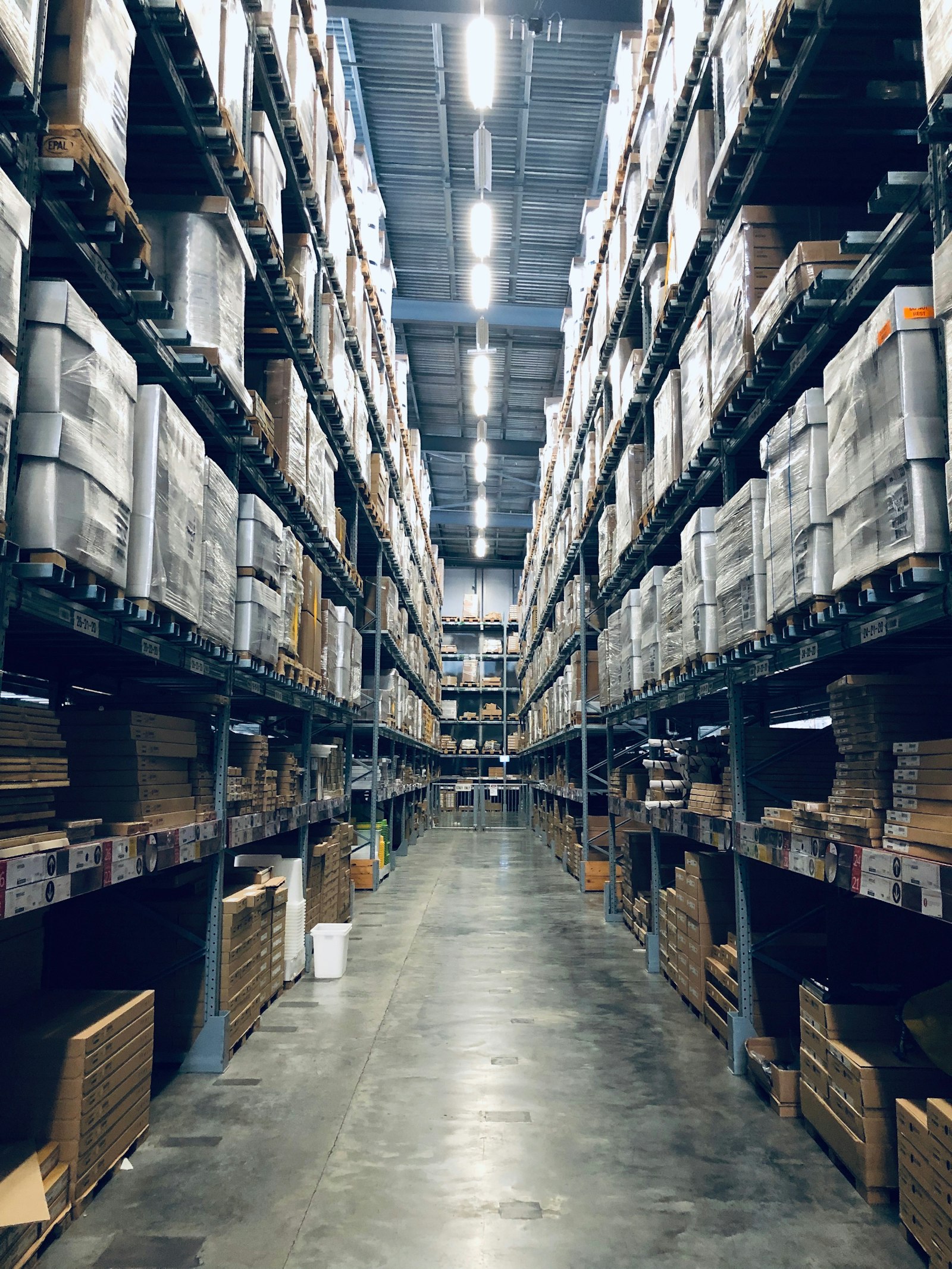 Modern warehouse aisle representing RFID and inventory automation