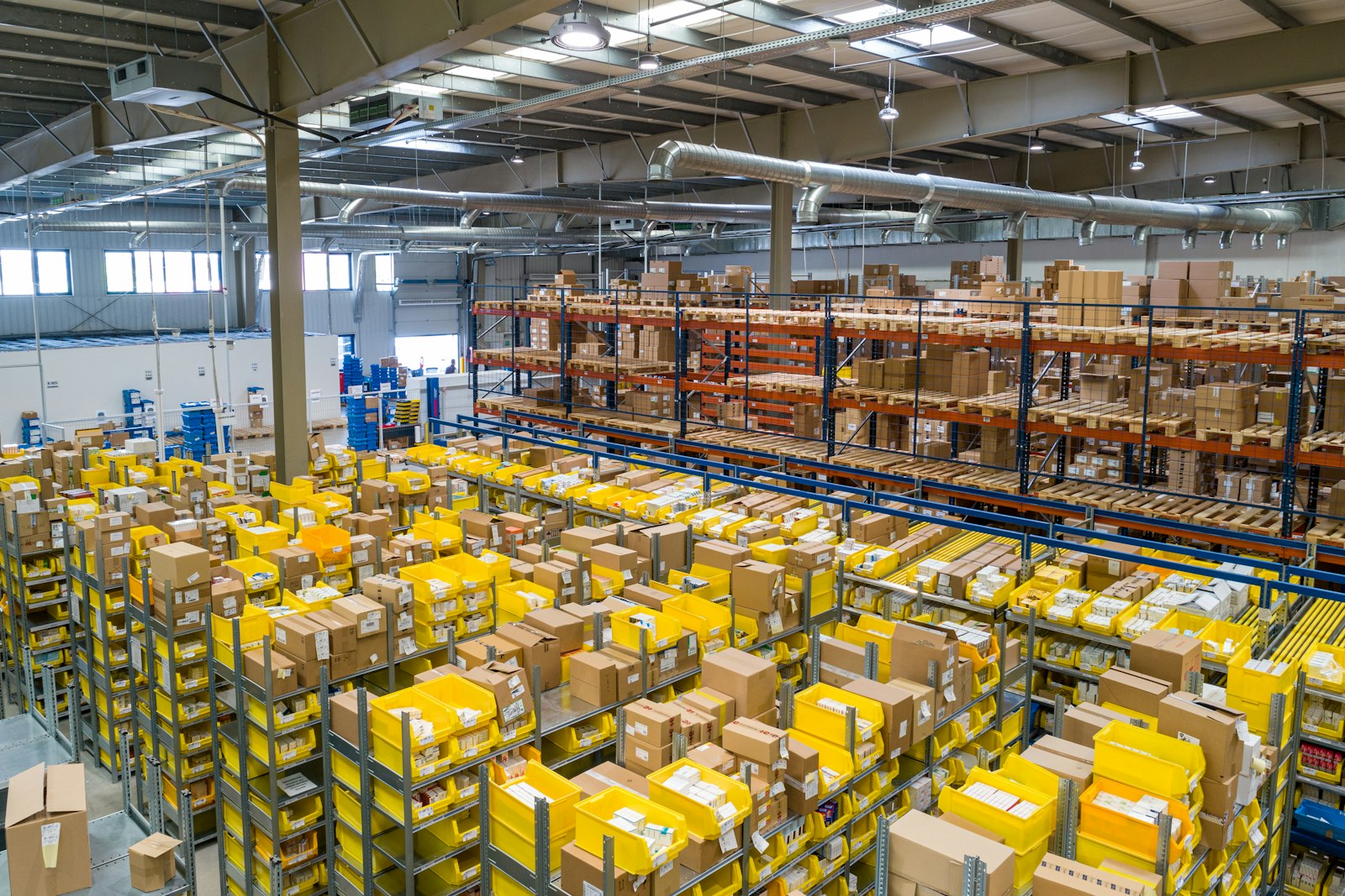 Warehouse bins and shelving seen from above, representing RFID inventory visibility and stock reconciliation